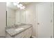 Bathroom vanity featuring granite counters, and a large mirror at 3913 Landgraf Cv, Decatur, GA 30034