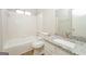 Bathroom with granite counters, tile floor, and shower-tub combination at 3913 Landgraf Cv, Decatur, GA 30034