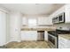 Well-lit kitchen with stainless steel appliances and granite countertops at 3913 Landgraf Cv, Decatur, GA 30034