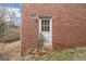 Back entrance featuring a vintage white door with a brick wall exterior at 2807 Knollview Dr, Decatur, GA 30034