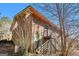 Brick exterior of a home with a metal stairway and balcony, surrounded by foliage at 2807 Knollview Dr, Decatur, GA 30034