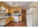 Functional kitchen featuring laminate floors, traditional appliances, and ample cabinet space at 2807 Knollview Dr, Decatur, GA 30034