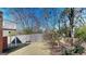 Well-maintained backyard featuring a partial wooden fence and mature trees at 2897 Macaw Nw St, Atlanta, GA 30318