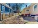 Gravel backyard area with mature trees and neighboring houses at 2897 Macaw Nw St, Atlanta, GA 30318