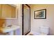 Bathroom boasts a vintage sink, medicine cabinet, toilet and enclosed shower with accent tile at 2897 Macaw Nw St, Atlanta, GA 30318