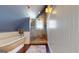 Attic bathroom featuring a soaking tub, enclosed shower, wood floors, and beadboard walls at 2897 Macaw Nw St, Atlanta, GA 30318