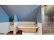 Attic bathroom boasts a claw foot tub, enclosed shower with decorative tile and beadboard walls at 2897 Macaw Nw St, Atlanta, GA 30318