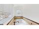 Relaxing soaking tub with tile surround and decorative window at 2897 Macaw Nw St, Atlanta, GA 30318