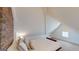 Bright bedroom with a unique brick wall and plush decor for a comfortable atmosphere at 2897 Macaw Nw St, Atlanta, GA 30318