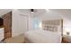 Cozy bedroom with a brick accent wall, plush bedding, and ample closet space at 2897 Macaw Nw St, Atlanta, GA 30318