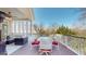 Cozy covered deck with white drapes, outdoor seating, and a dining area at 2897 Macaw Nw St, Atlanta, GA 30318