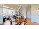 Elegant dining area with large table, tiled floors, and access to the outdoor patio at 2897 Macaw Nw St, Atlanta, GA 30318