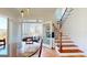 Elegant dining room with tile floors and access to outdoor living space and staircase at 2897 Macaw Nw St, Atlanta, GA 30318