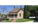 Charming two-story home featuring a welcoming front porch, well-maintained lawn and manicured landscaping at 2897 Macaw Nw St, Atlanta, GA 30318