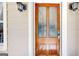 Elegant front door featuring decorative glass panels and classic sconce lighting at 2897 Macaw Nw St, Atlanta, GA 30318