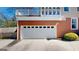 Exterior view of the garage featuring a white door with window panes at 2897 Macaw Nw St, Atlanta, GA 30318