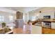 Open kitchen flowing into a living area with an exposed brick column and tiled floors at 2897 Macaw Nw St, Atlanta, GA 30318