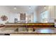Stylish kitchen sink area with granite countertops and view into the living space at 2897 Macaw Nw St, Atlanta, GA 30318