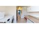 Functional laundry room with modern appliances, counter space, and ample storage at 2897 Macaw Nw St, Atlanta, GA 30318