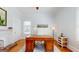 Bright office featuring hardwood floors, a large desk, and decorative fireplace at 2897 Macaw Nw St, Atlanta, GA 30318