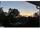 Evening shot overlooking trees showcasing a colorful sunset view at 2897 Macaw Nw St, Atlanta, GA 30318