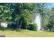 Inviting home nestled amongst mature trees; features a backyard deck at 6012 Happy Trls Ct, Lithonia, GA 30058