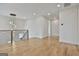Open hallway featuring hardwood floors, modern lighting, and a stylish chandelier overlooking the staircase at 1240 Hayes Sq, Peachtree City, GA 30269