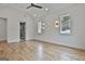 A sun-drenched primary suite featuring a vaulted ceiling, recessed lighting, and hardwood floors at 1240 Hayes Sq, Peachtree City, GA 30269