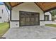 Charming patio area with gray stone tiles, offering a view of the backyard through glass doors at 1240 Hayes Sq, Peachtree City, GA 30269