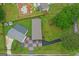 Overhead view showcasing the home, detached garage, ample yard space, and distinct driveway at 80 David Rd, Hampton, GA 30228