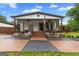 Charming home with a welcoming porch, wagon wheel decor, and a manicured front yard at 80 David Rd, Hampton, GA 30228