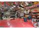 Spacious garage with walls and ceilings covered in racing memorabilia at 80 David Rd, Hampton, GA 30228