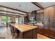 Well-lit kitchen with a large island, modern appliances, and ample counter space at 80 David Rd, Hampton, GA 30228