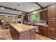 Spacious kitchen with wooden cabinets, an island, and stainless steel appliances at 80 David Rd, Hampton, GA 30228