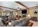 Inviting living area with an open floor plan, stone fireplace, and stylish decor at 80 David Rd, Hampton, GA 30228