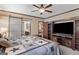 Spacious main bedroom featuring an entertainment center, storage shelves, and a modern design at 80 David Rd, Hampton, GA 30228