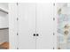 View of closet doors, shower with glass and fixtures, and part of a built in closet at 915 Laurel Brooke Ave, Peachtree City, GA 30269