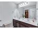 Bright bathroom featuring double sinks, a large mirror, and modern fixtures at 3259 Baylor Cir, Mcdonough, GA 30253