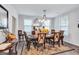 Elegant dining room featuring a large table with seating for six and decorative accents at 3259 Baylor Cir, Mcdonough, GA 30253