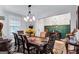 Dining room showcasing a large table, stylish seating, and a view into the entryway at 3259 Baylor Cir, Mcdonough, GA 30253