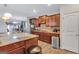 Charming kitchen boasts wood floors, granite counters, stainless appliances, and ample cabinet space at 3259 Baylor Cir, Mcdonough, GA 30253
