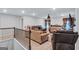 Upstairs living room with comfortable seating and natural light from the stairway and door at 3259 Baylor Cir, Mcdonough, GA 30253