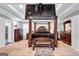 Spacious main bedroom boasts a tray ceiling, four-poster bed, a bench, and modern furnishings at 3259 Baylor Cir, Mcdonough, GA 30253