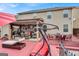 Spacious covered patio with multiple seating areas, perfect for outdoor relaxation and entertaining at 3259 Baylor Cir, Mcdonough, GA 30253
