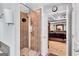 Walk-in shower featuring tile walls and rainfall showerhead and a doorway leading into the main bedroom at 3259 Baylor Cir, Mcdonough, GA 30253