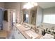 Bathroom featuring a dual vanity with granite counters and ample lighting at 416 Line Creek Cir, Sharpsburg, GA 30277