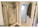 Bathroom featuring a glass-enclosed shower and a view of the commode at 416 Line Creek Cir, Sharpsburg, GA 30277