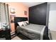 This bedroom features a decorated peach colored wall, closet and a queen sized bed at 416 Line Creek Cir, Sharpsburg, GA 30277