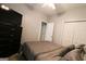 Spacious bedroom featuring a queen-sized bed, TV on dresser, with double closet and a neutral color scheme at 416 Line Creek Cir, Sharpsburg, GA 30277