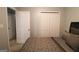 Bedroom featuring a double closet, doorway, neutral color scheme and a comfortable queen-sized bed at 416 Line Creek Cir, Sharpsburg, GA 30277